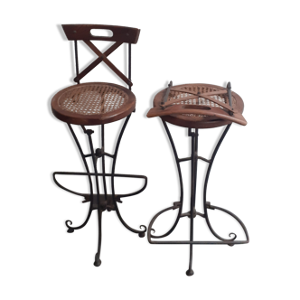 Wrought iron stools seated in canage