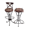 Wrought iron stools seated in canage