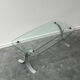 Design coffee table in brushed metal with a glass top, 1970s.