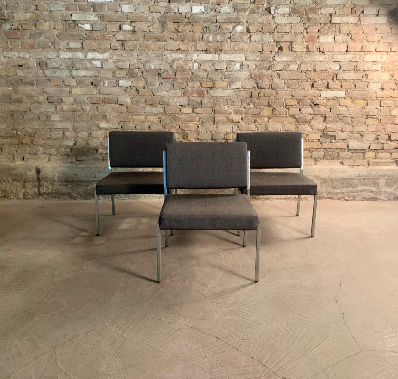 Armchair in metal and grey fabric