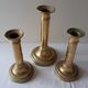Lot of three old brass candlesticks