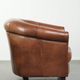 Vintage sheepskin club armchair in English style with deep colours