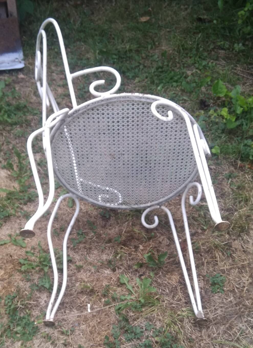 Mategot-style perforated wrought iron garden furniture with table and armchairs