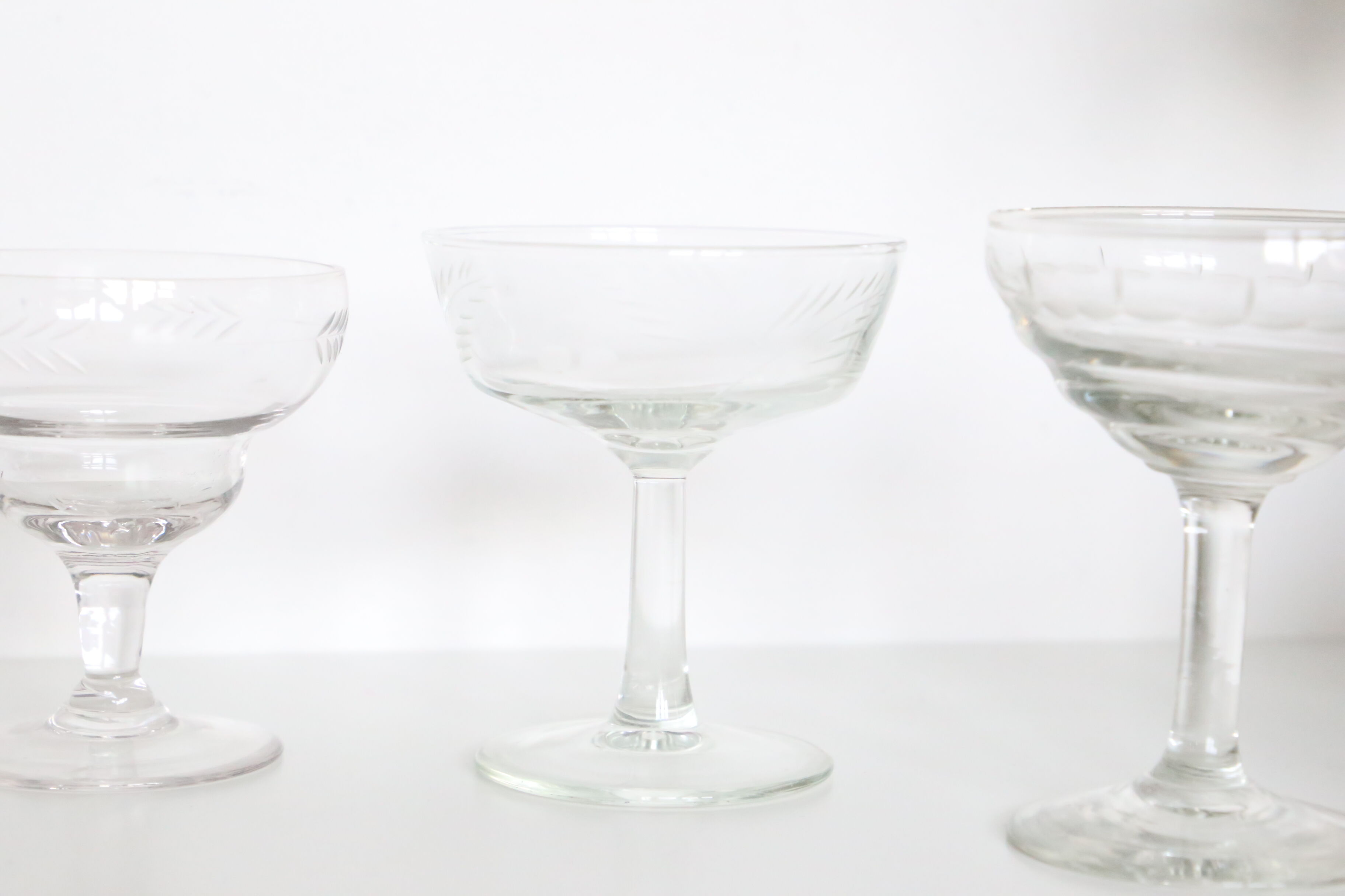 Set of 6 mismatched champagne glasses, chiseled glass