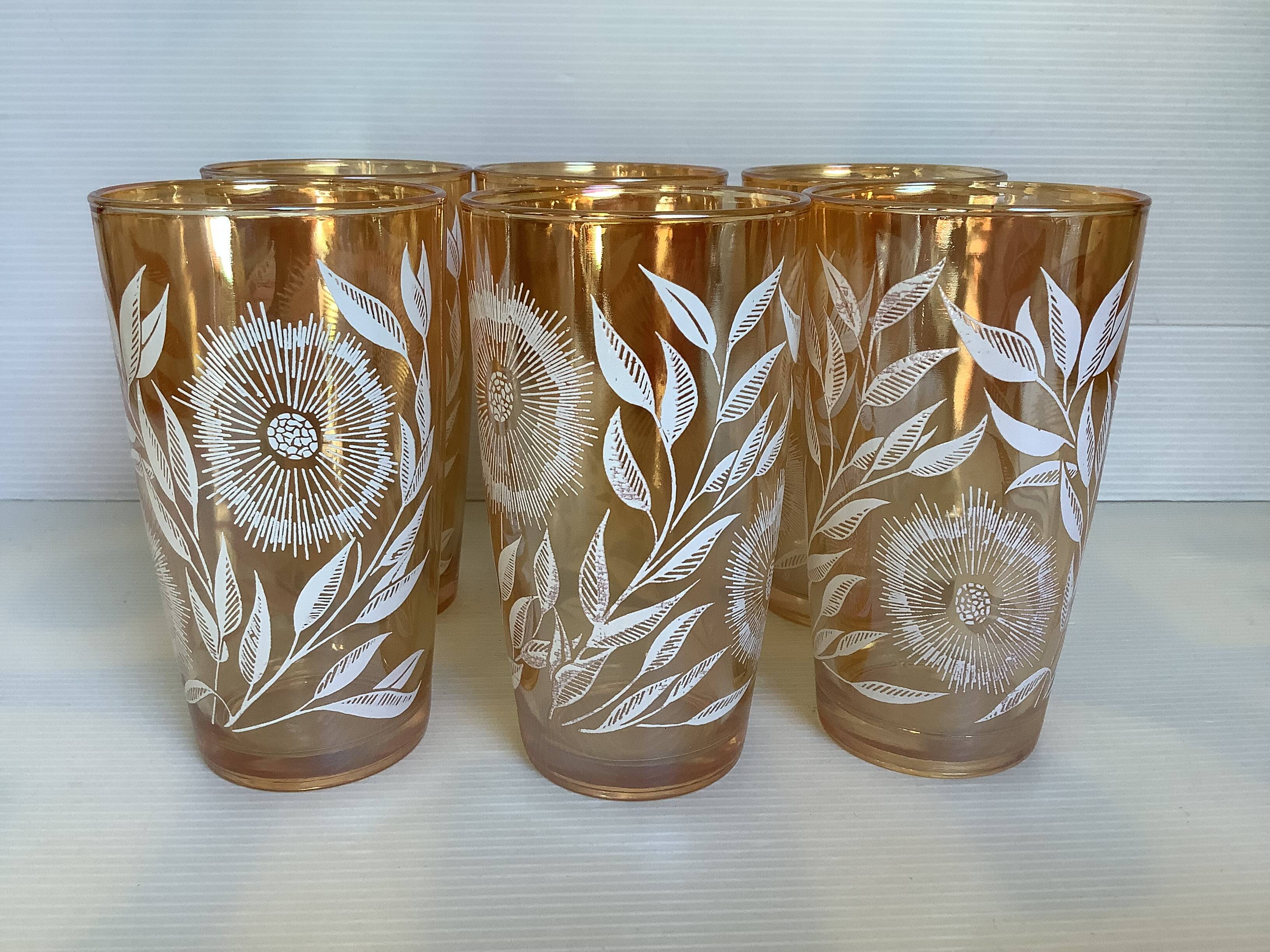 Service of marigold lemonade with iridescent reflections.