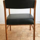 Chair in light teak and black skaï from the 1960s