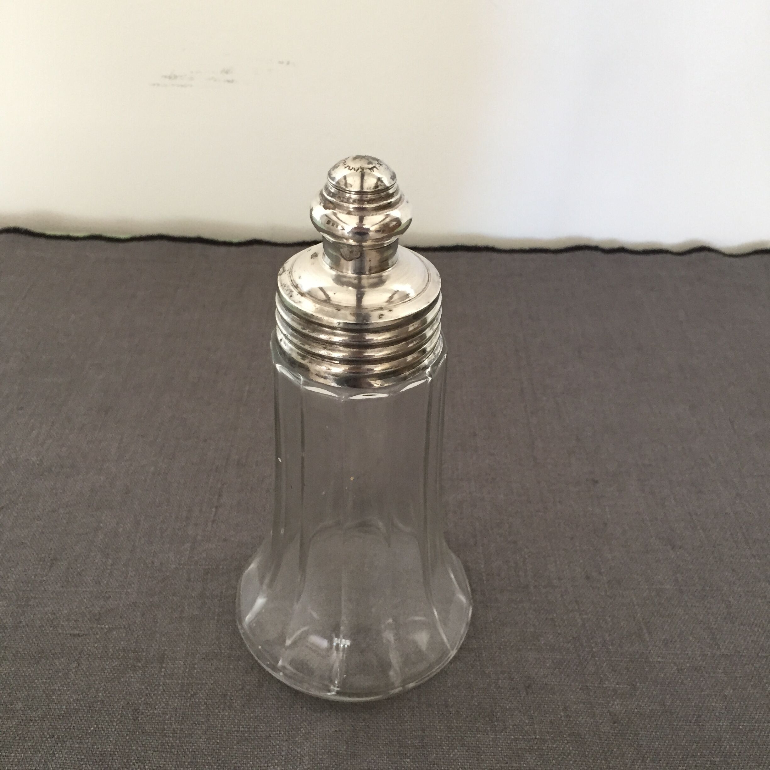 Glass sugar sprinkler and silver metal