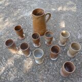 Service mazagrans and decanter in enamelled stoneware.