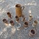 Service mazagrans and decanter in enamelled stoneware.