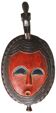 Masque africain en bois, visage surmonté d’un oiseau