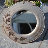 Round ceramic mirror signed