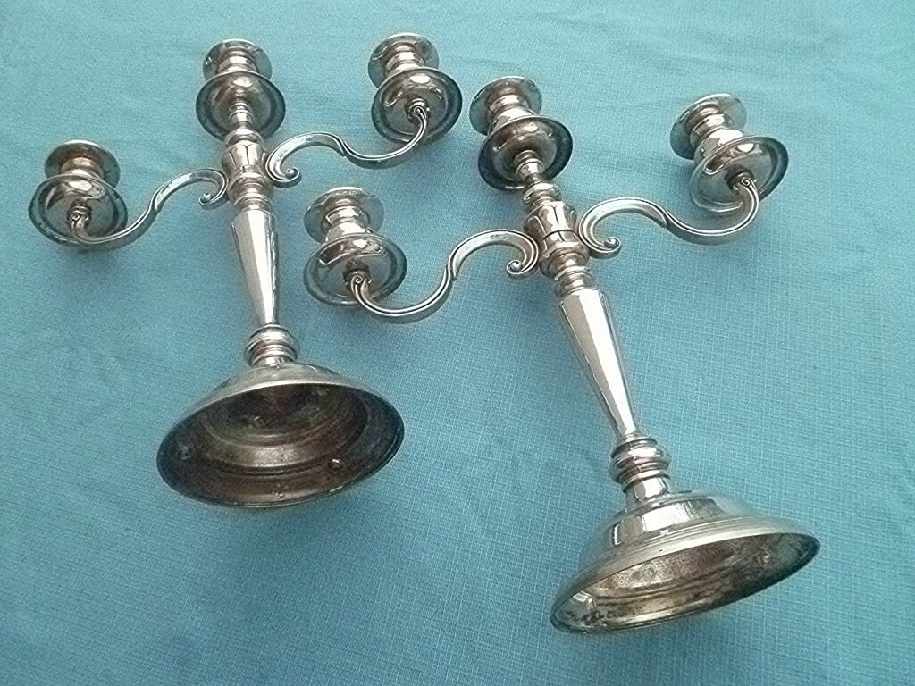 Pair of silver-colored metal candlesticks