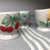 Ceramic shells with relief decoration of flowers (yellow and red) and fruits (cherries and grapes)