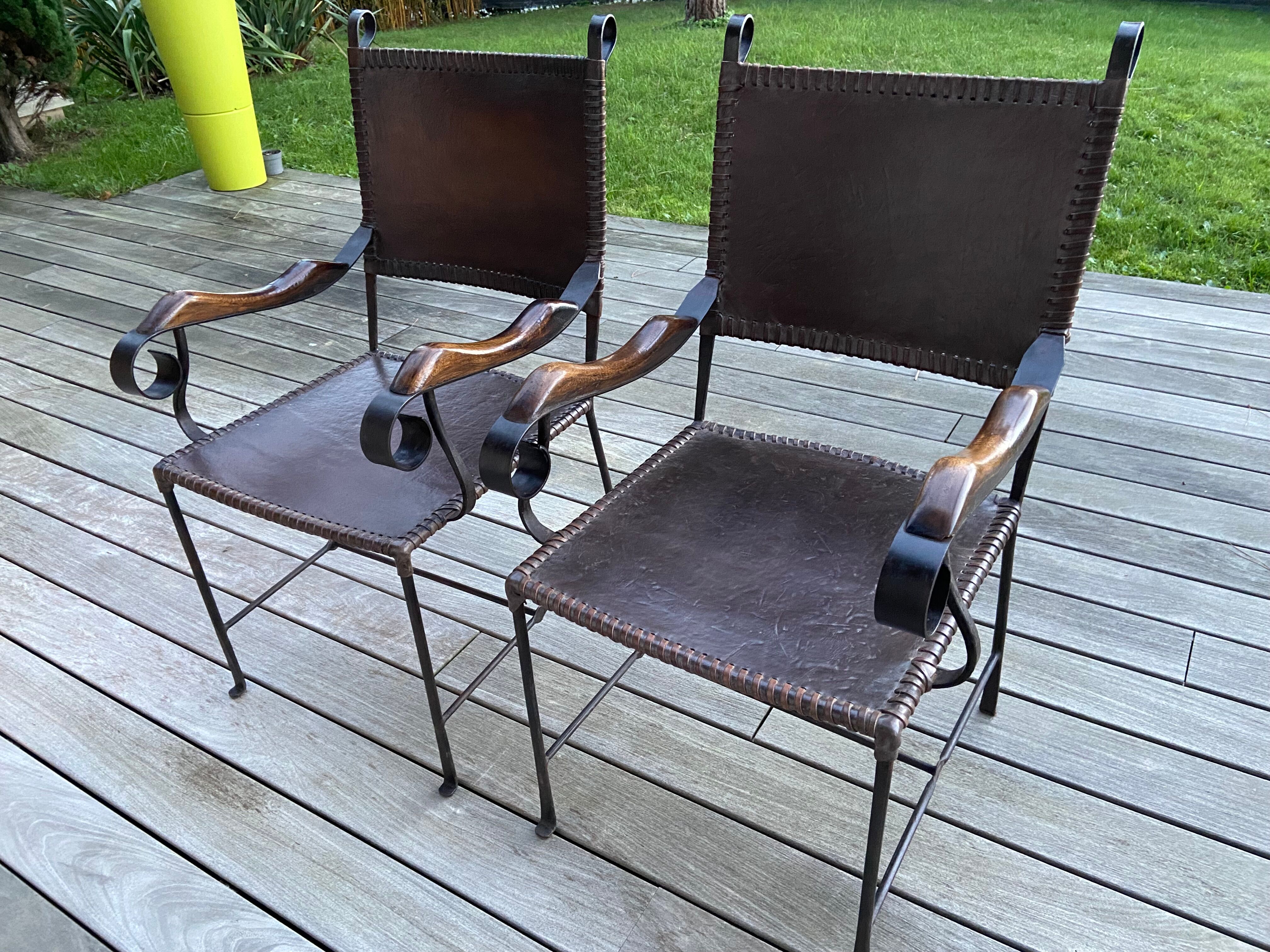 Leather and wrought iron armchairs