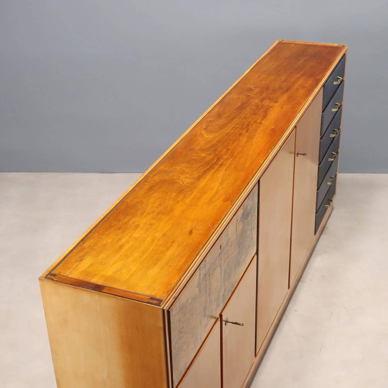 Vintage storage furniture in maple veneer with a glass top, Italian design 1950s.