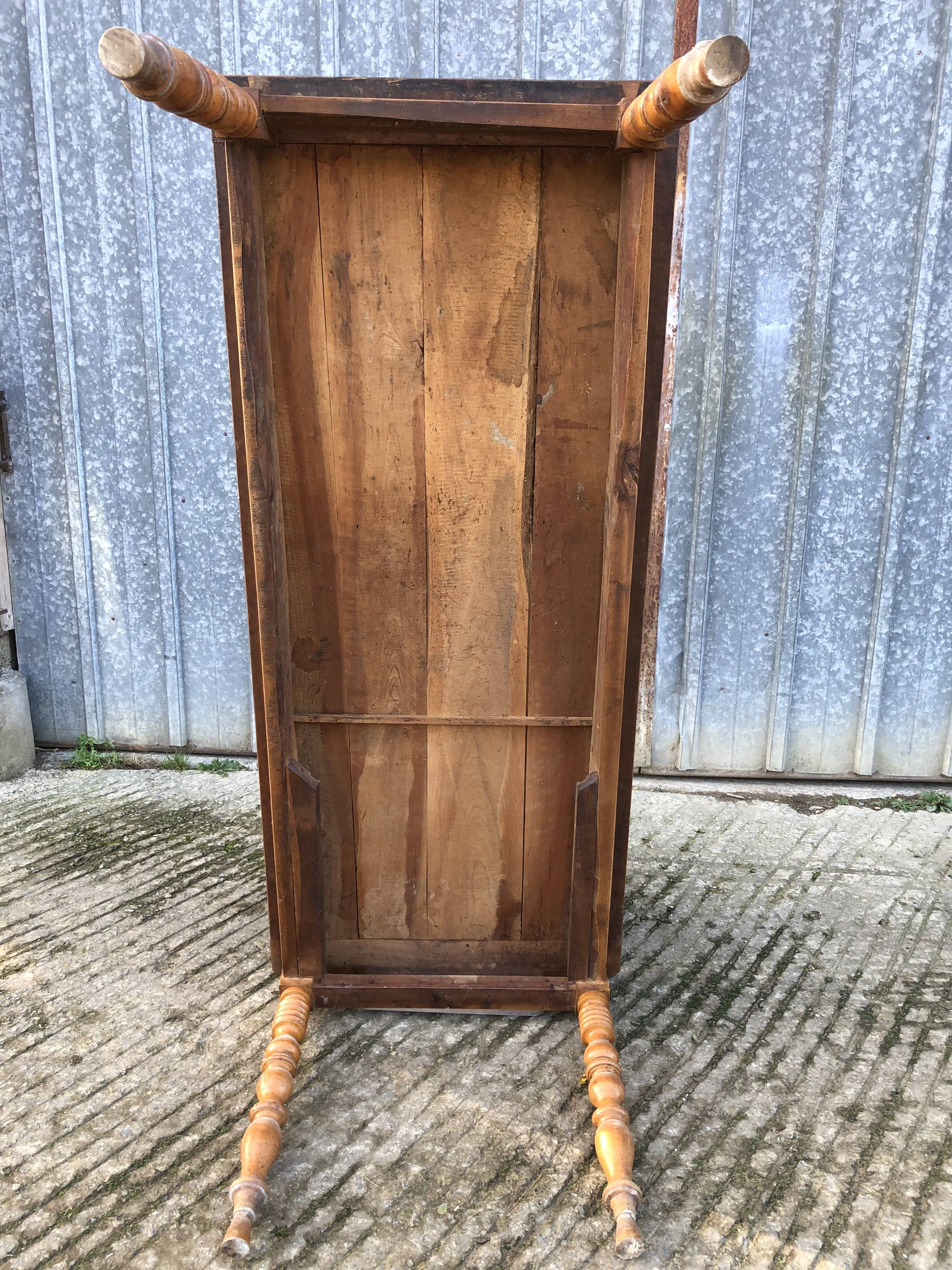 Antique farmhouse table in solid cherry wood with turned legs.
