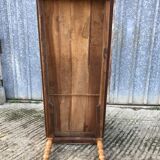 Antique farmhouse table in solid cherry wood with turned legs.