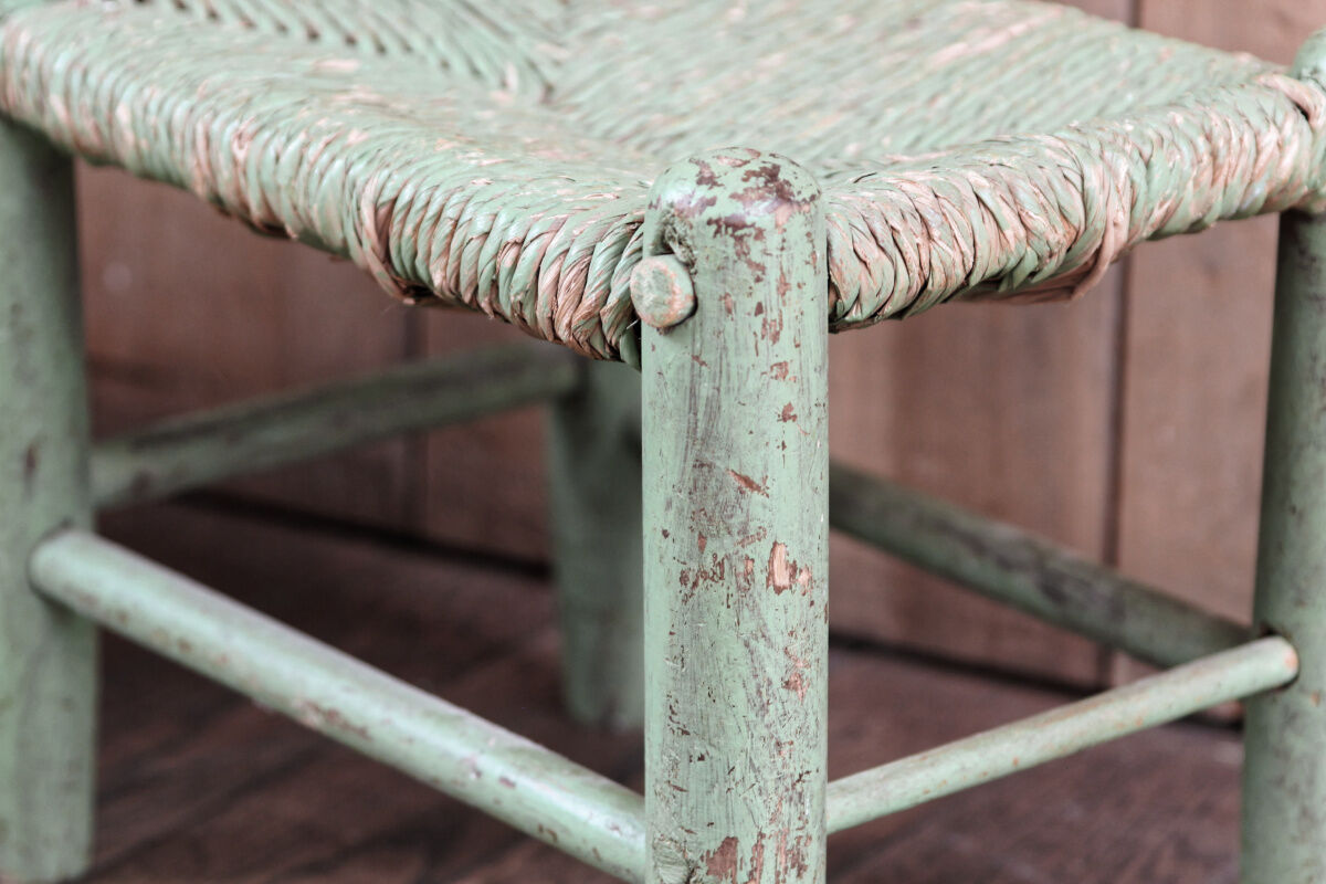 Old wooden and straw stool