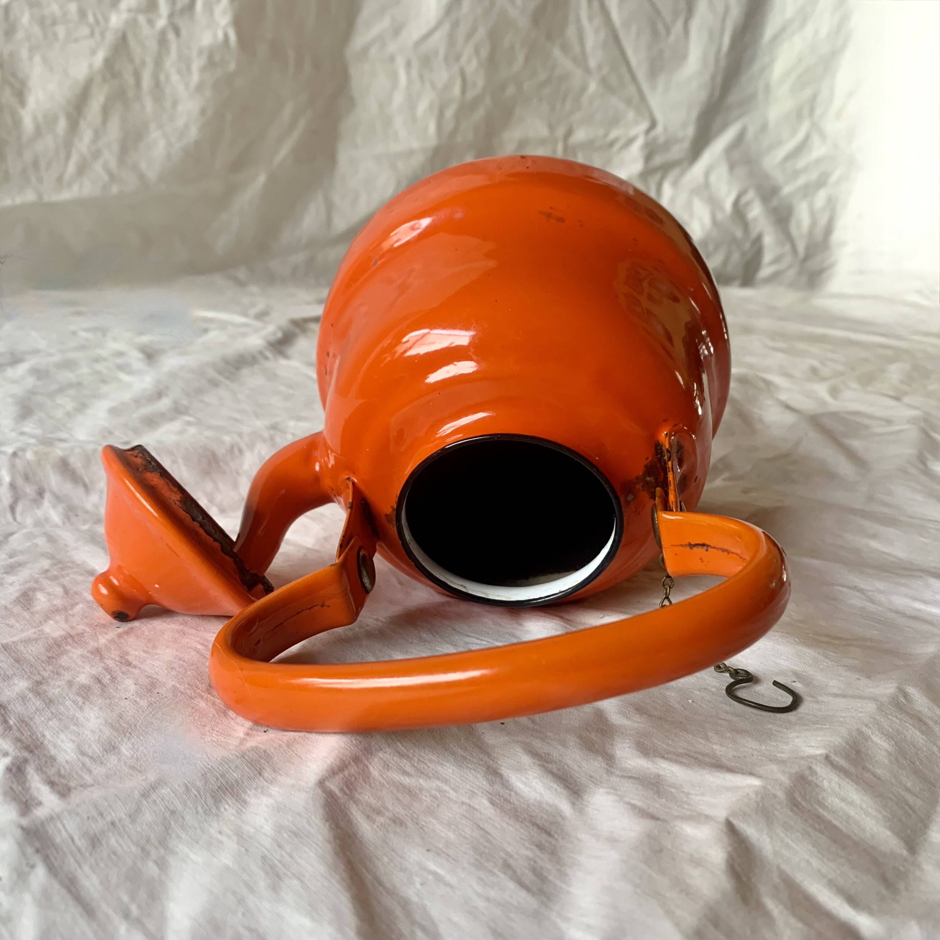 Vintage orange enameled sheet metal kettle