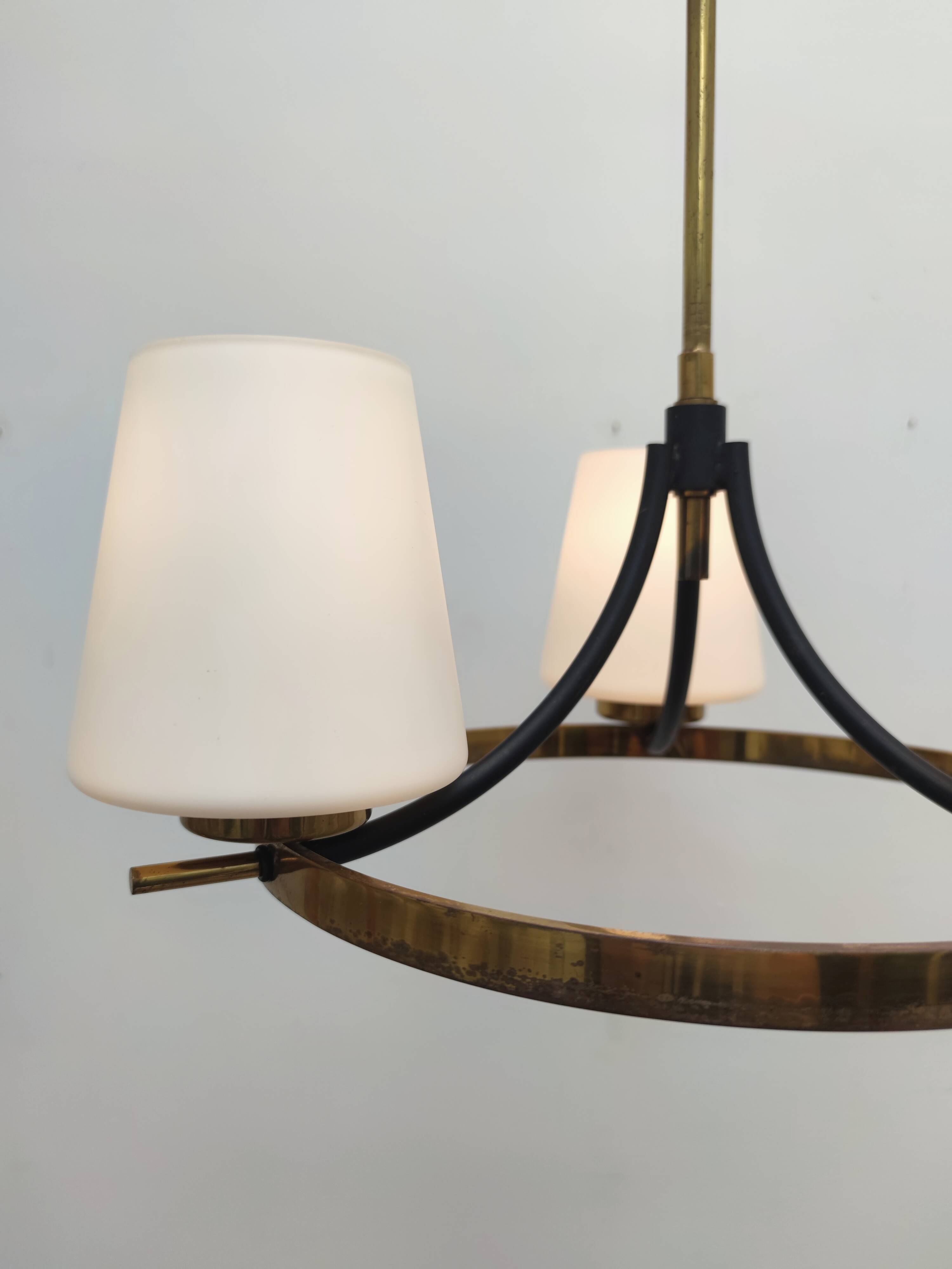 Brass chandelier and white opalines