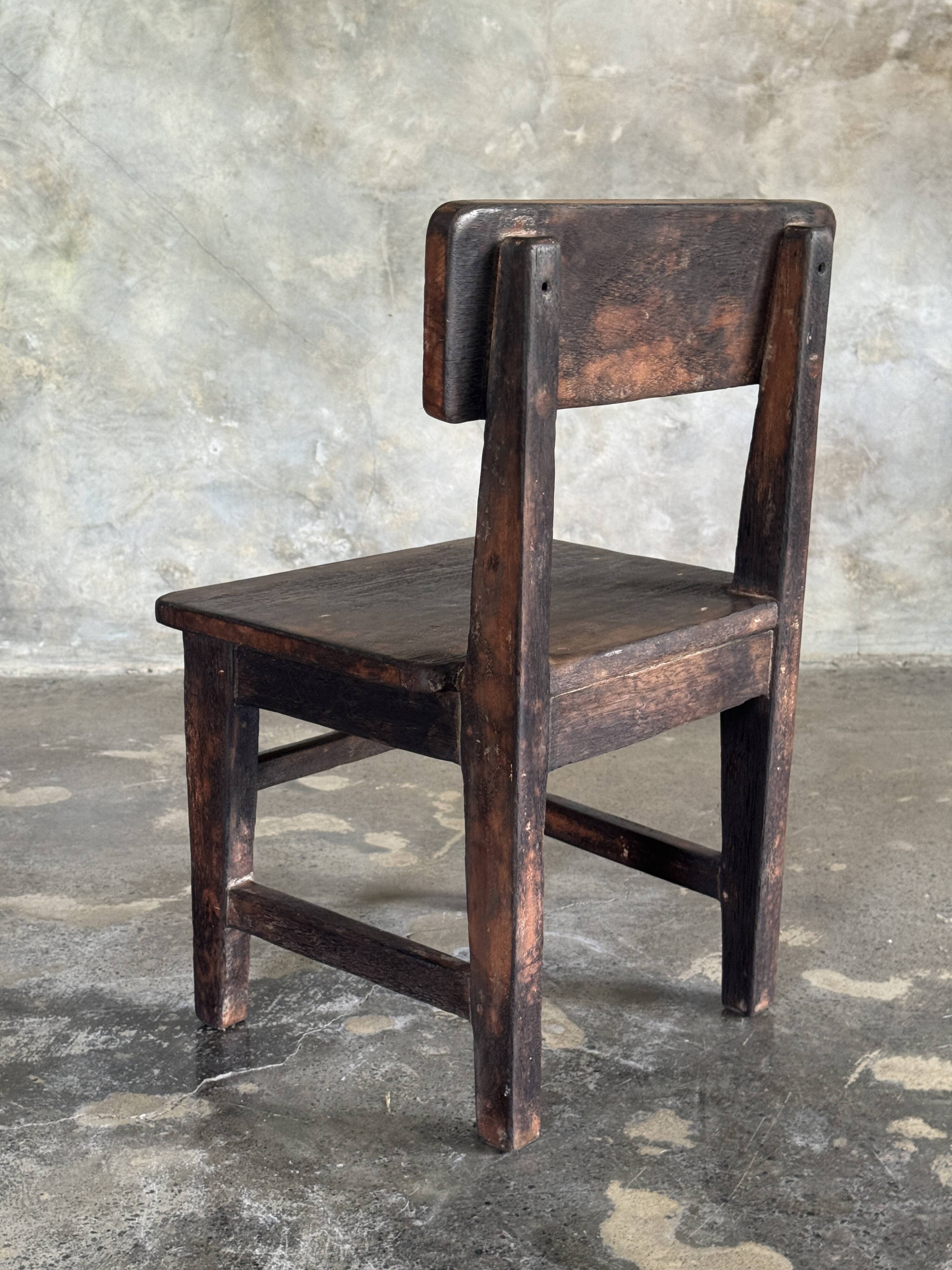 Small antique Indonesian children's chair in teak.