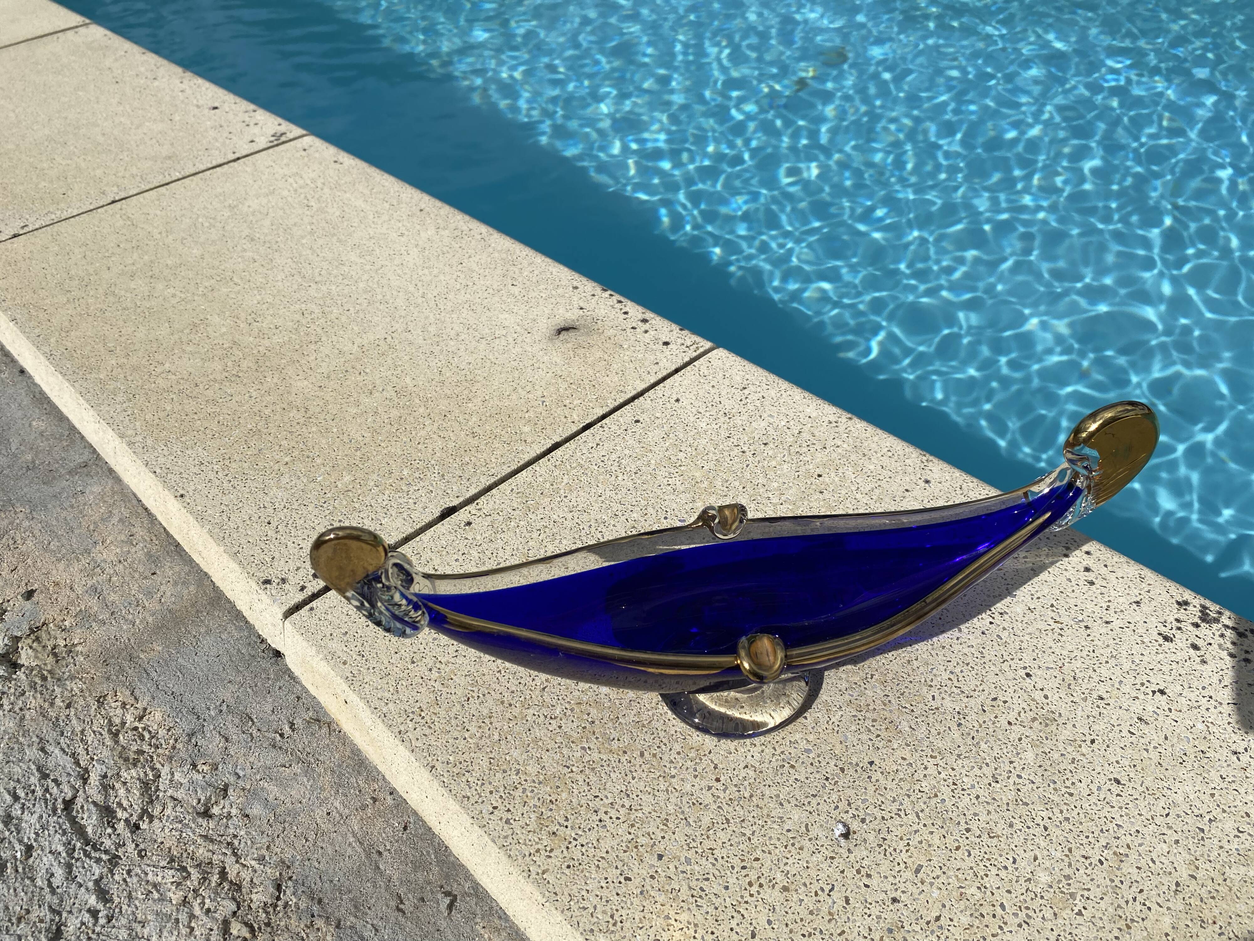 Vintage cobalt blue Murano glass gondola bowl with gilding.