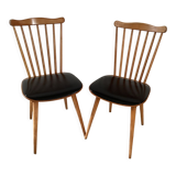 2 baumann chairs seated in imitation black leather