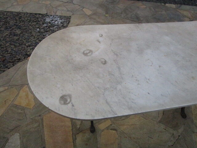 Old bistro table in marble and godin cast iron foot
