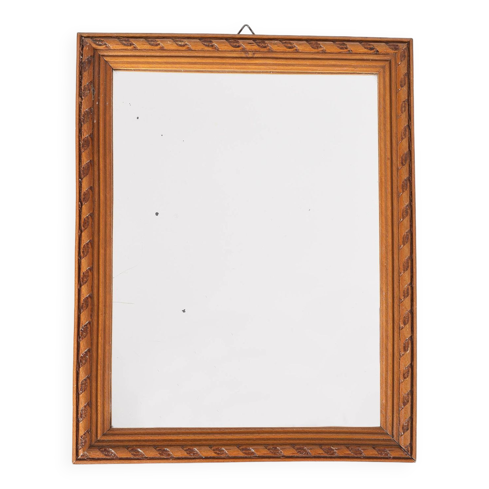 Small old wooden mirror with carved frame