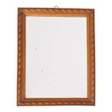 Small old wooden mirror with carved frame