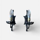 Vintage wrought iron wall lights in rustic gothic style.