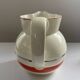Red, white and silver porcelain jug set by Edmond Bellefroid for Robo.