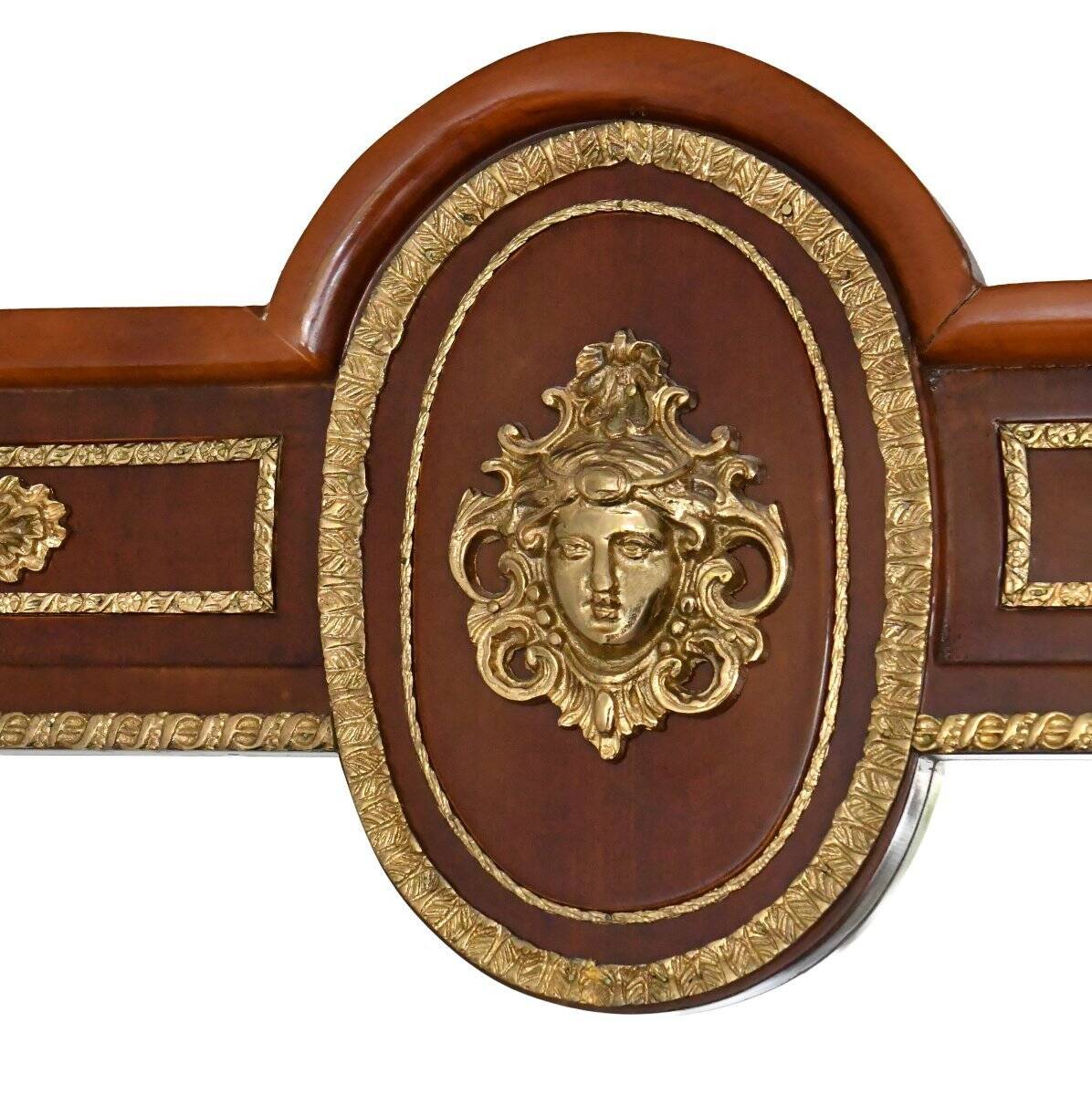 Console topped with an Empire-style mirror.