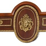 Console topped with an Empire-style mirror.