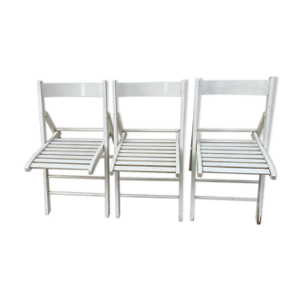 3 folding chairs in white painted wood