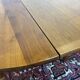 Round cherry wood table, 6 feet, Louis Philippe style with 2 extensions.