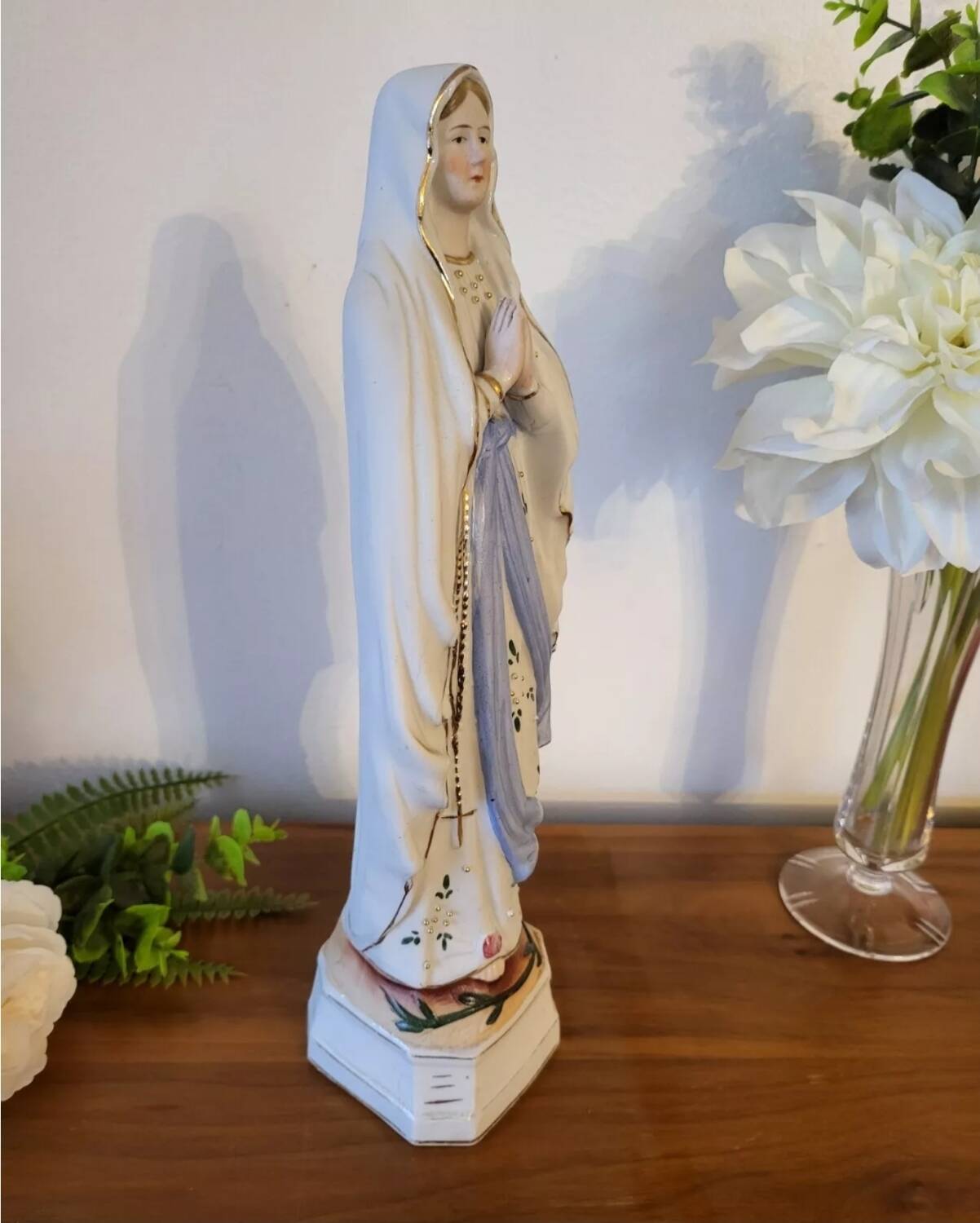Religious statuette of the Virgin Mary in bisque porcelain