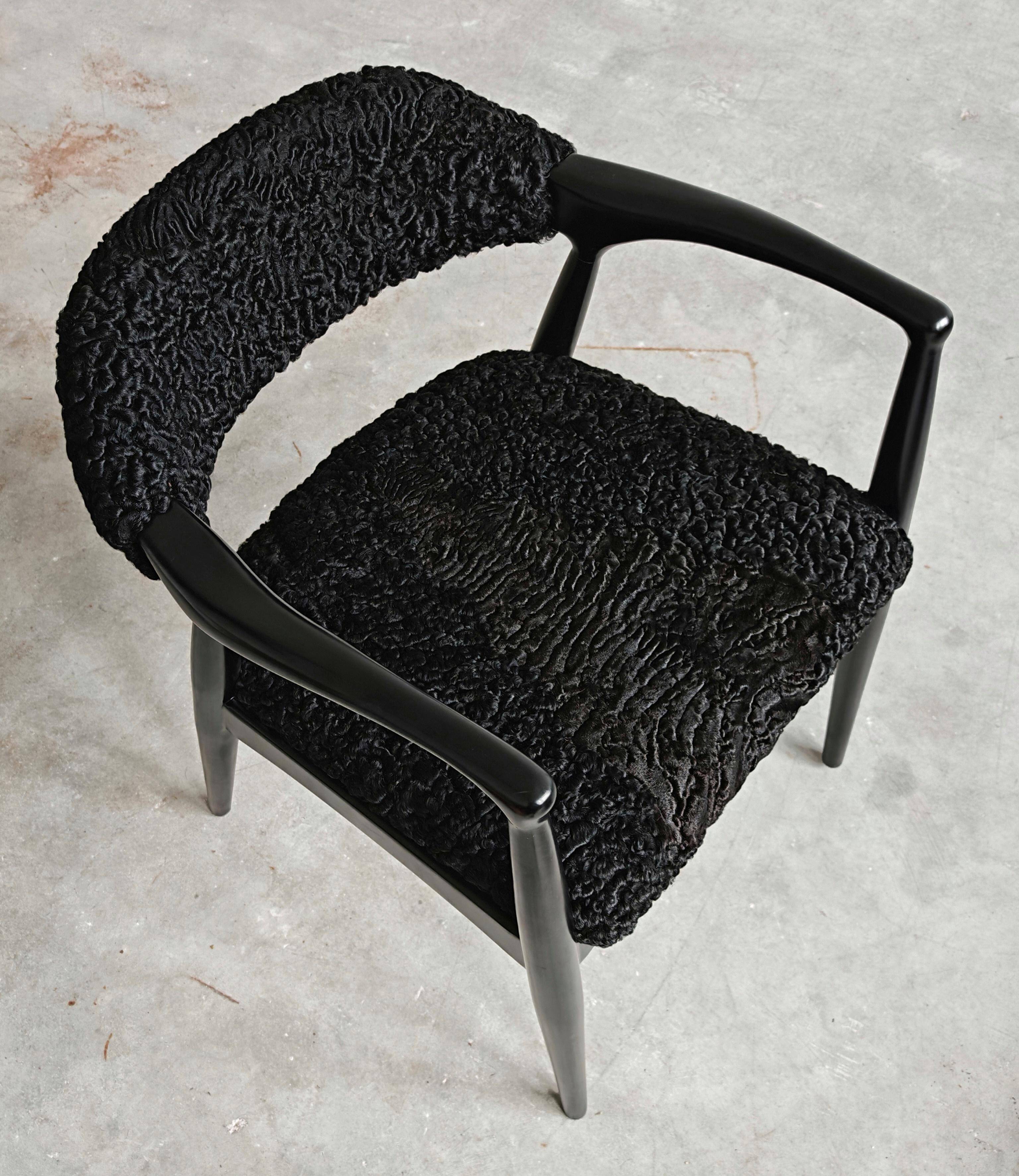 Pair of Mid Century Modern armchairs in astrakhan leather.