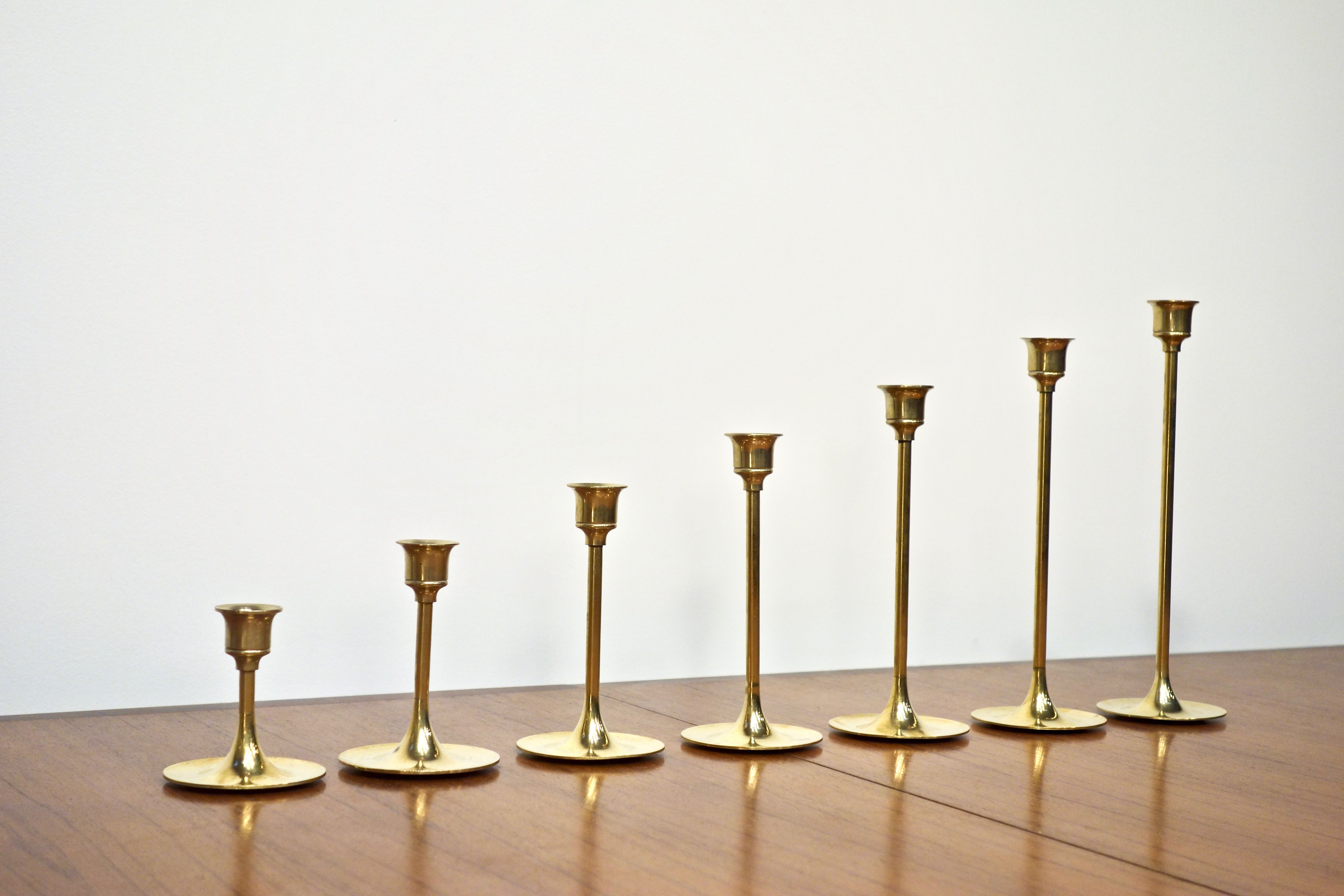 Set of 7 Scandinavian brass candle holders, 1960's