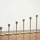 Set of 7 Scandinavian brass candle holders, 1960's