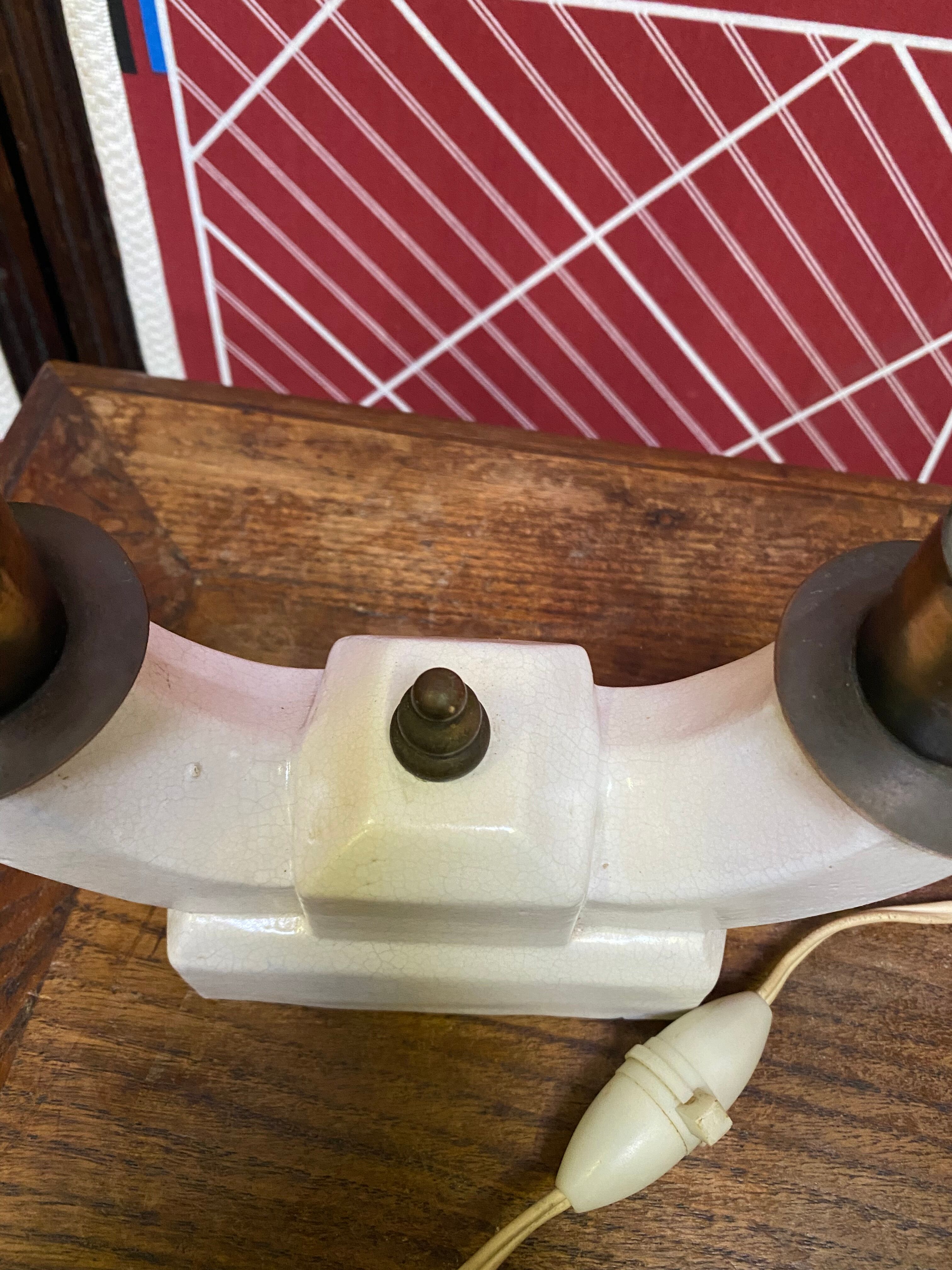Pair of ceramic and brass office chandeliers