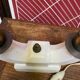 Pair of ceramic and brass office chandeliers
