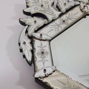 Venetian wall mirror in Murano glass with faceted floral decoration from the 1930s.