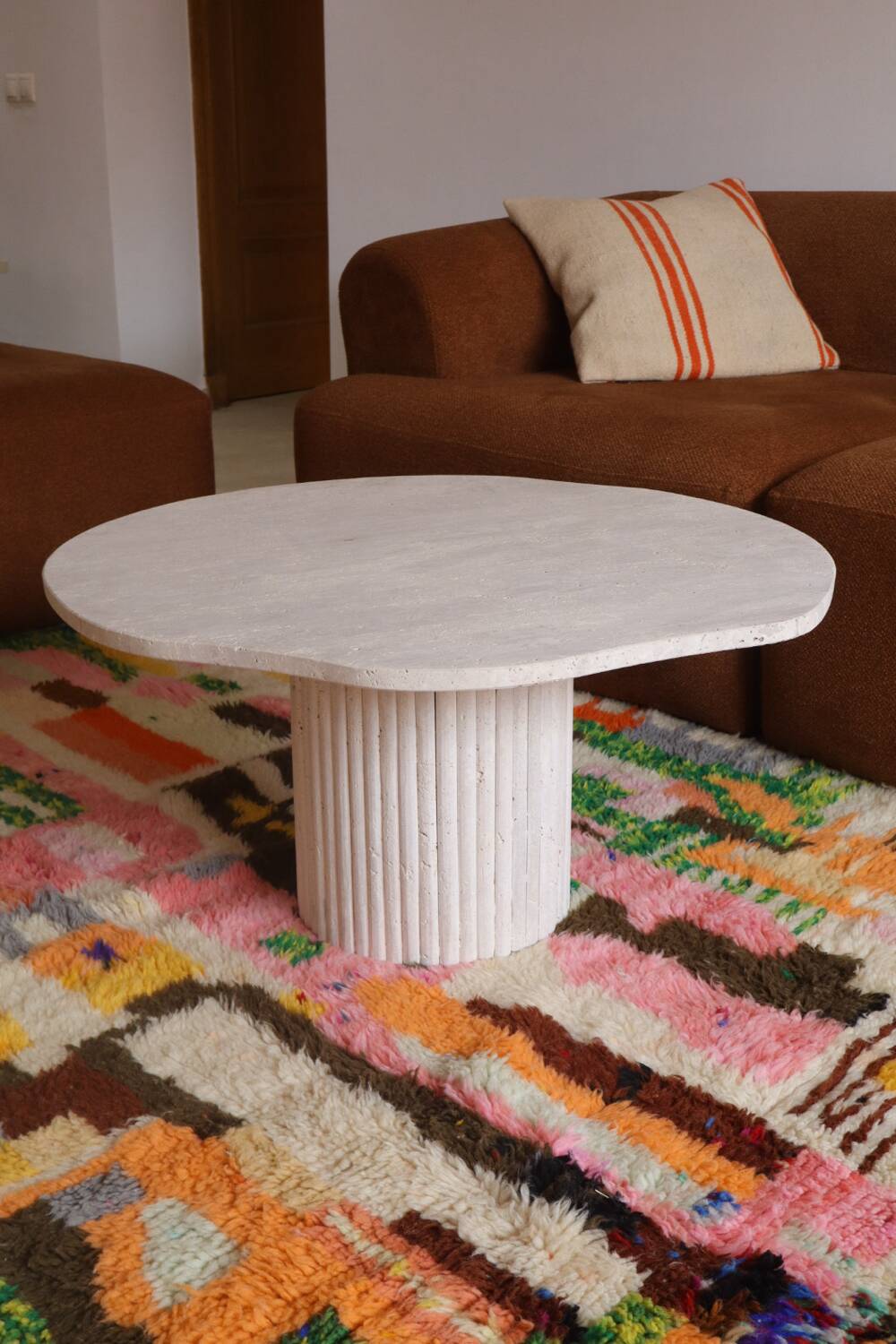 Organic shape travertine coffee table
