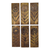 Six cleanliness plaques, flower design, brass.