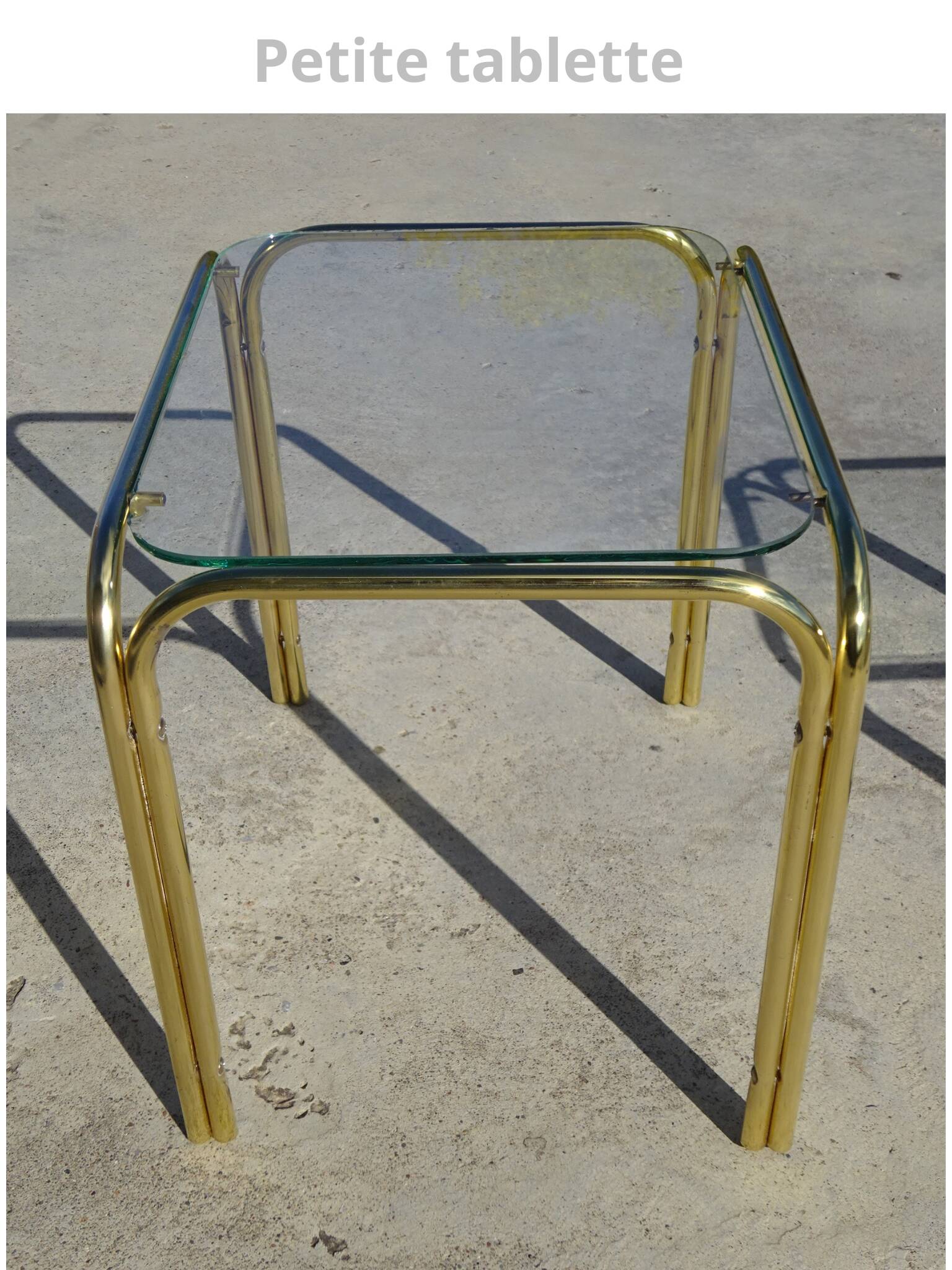 Nesting tables in gold-tone metal and glass