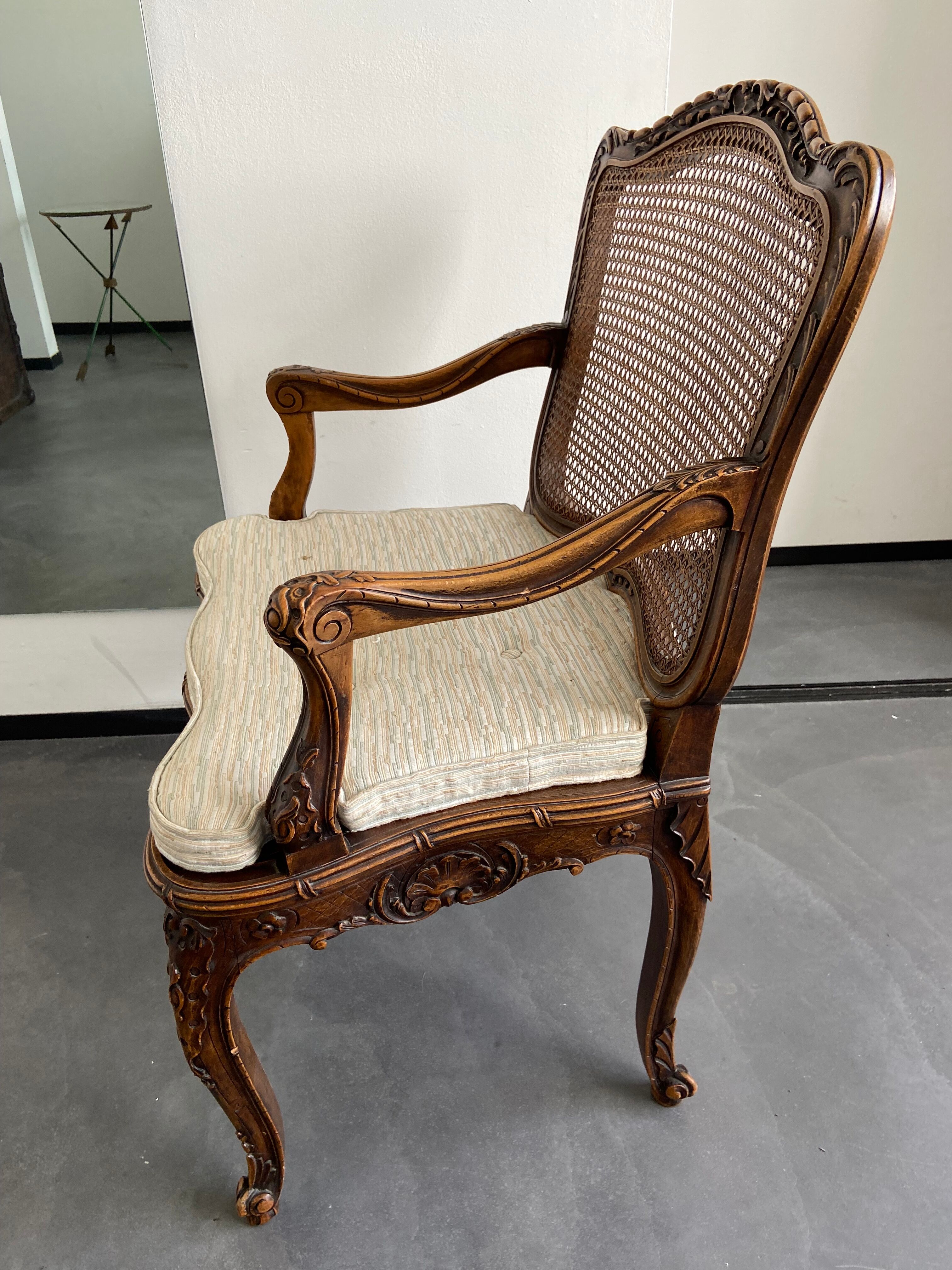 Regency canned armchair in carved walnut