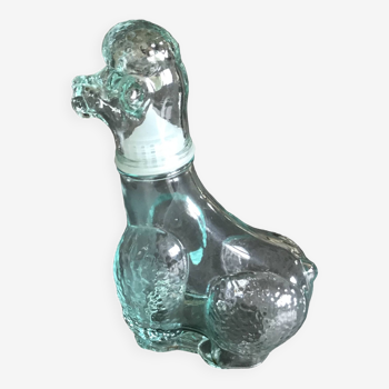 Bottle poodle dog bottle in empolied glass, italy