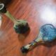 Pair of flower vases in glass paste, with a long slender neck.