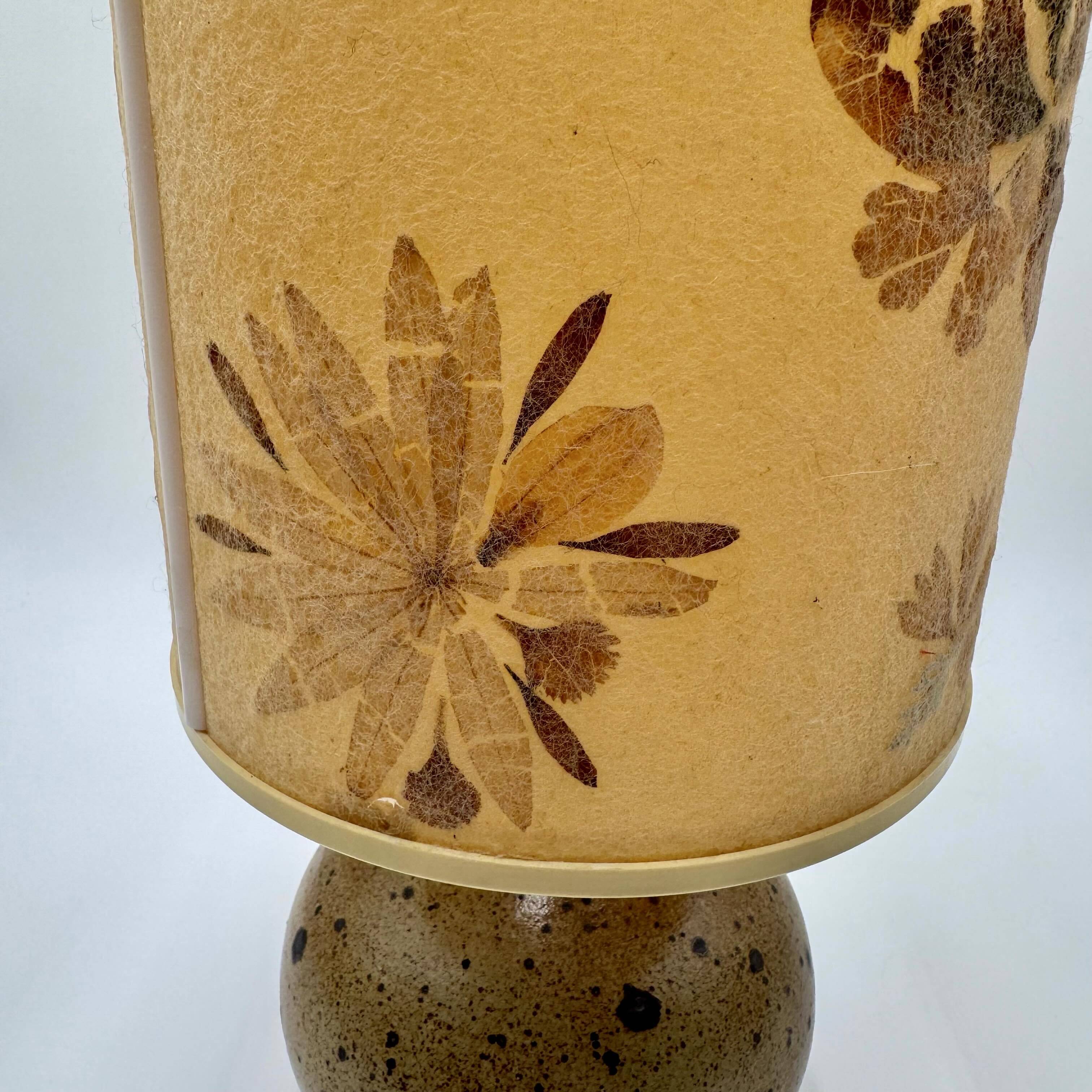 Pyrite stone ball lamp with a lampshade featuring dried flower inclusions.